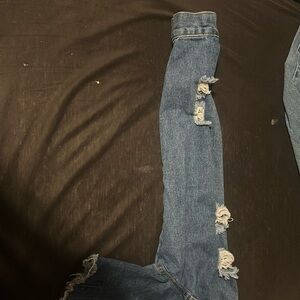 Not My style, but it's cute. It's size large blue Jean jacket.